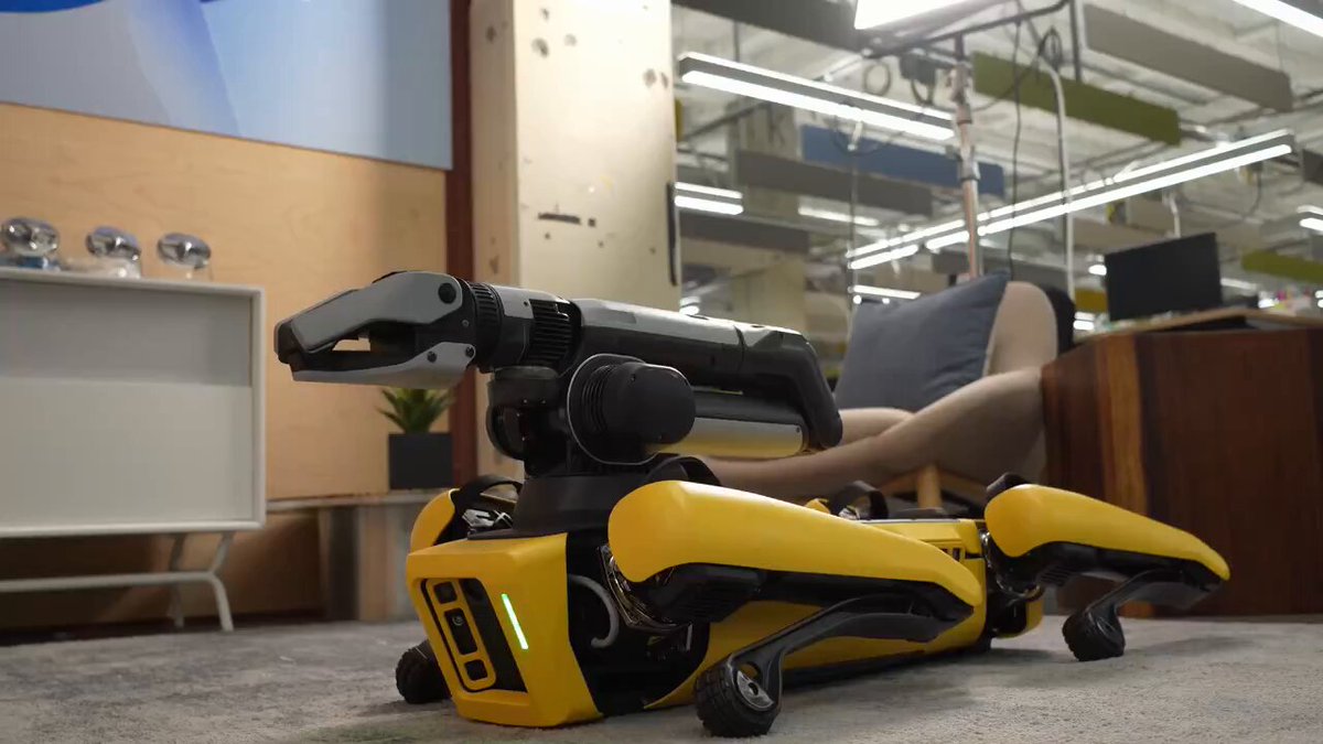 Robot picking up a can and using trash bin