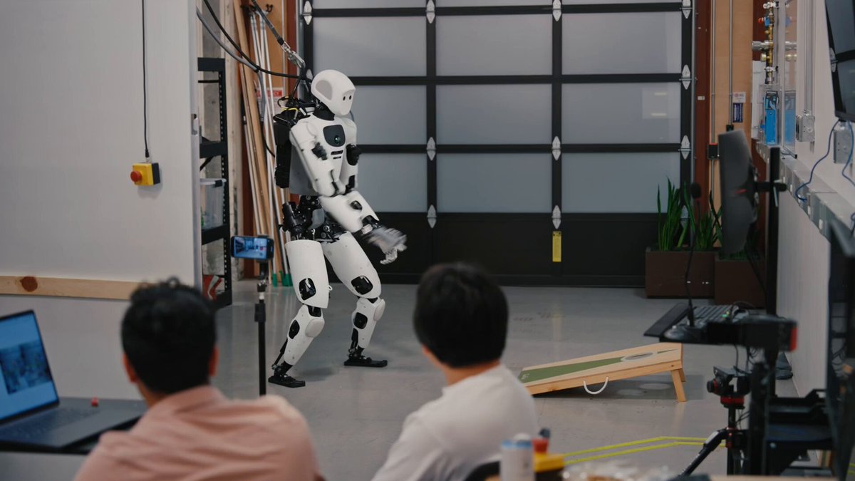 Apollo 2 humanoid robot playing cornhole via simulation