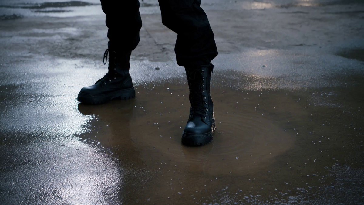Hand-to-hand combat under a rainy urban overpass