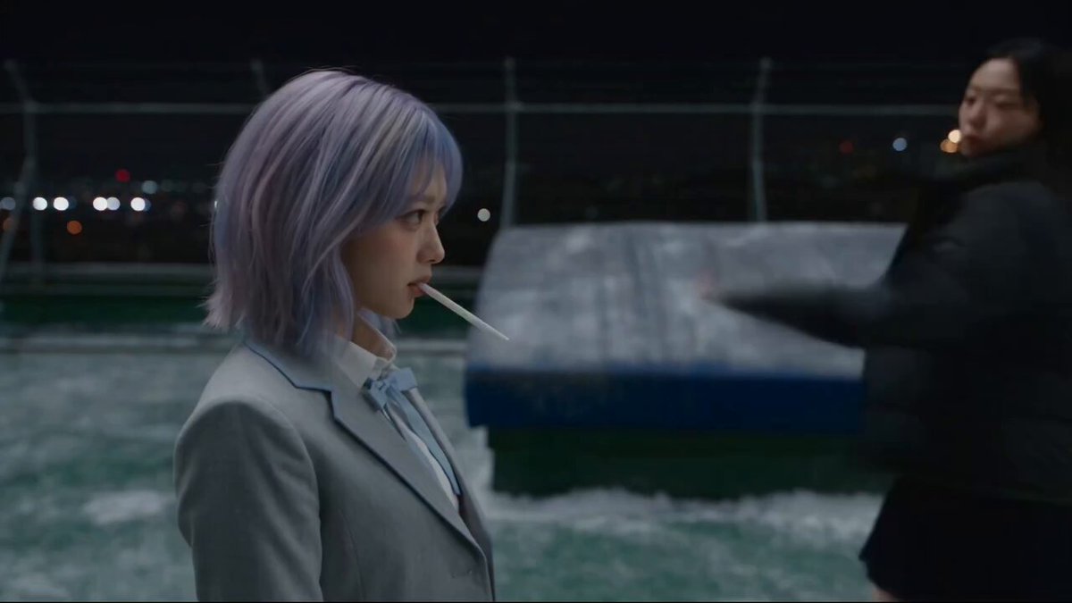 Anime student using ice magic on a rooftop