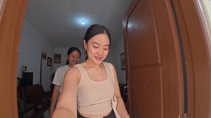 Handheld mini DV camcorder footage of woman